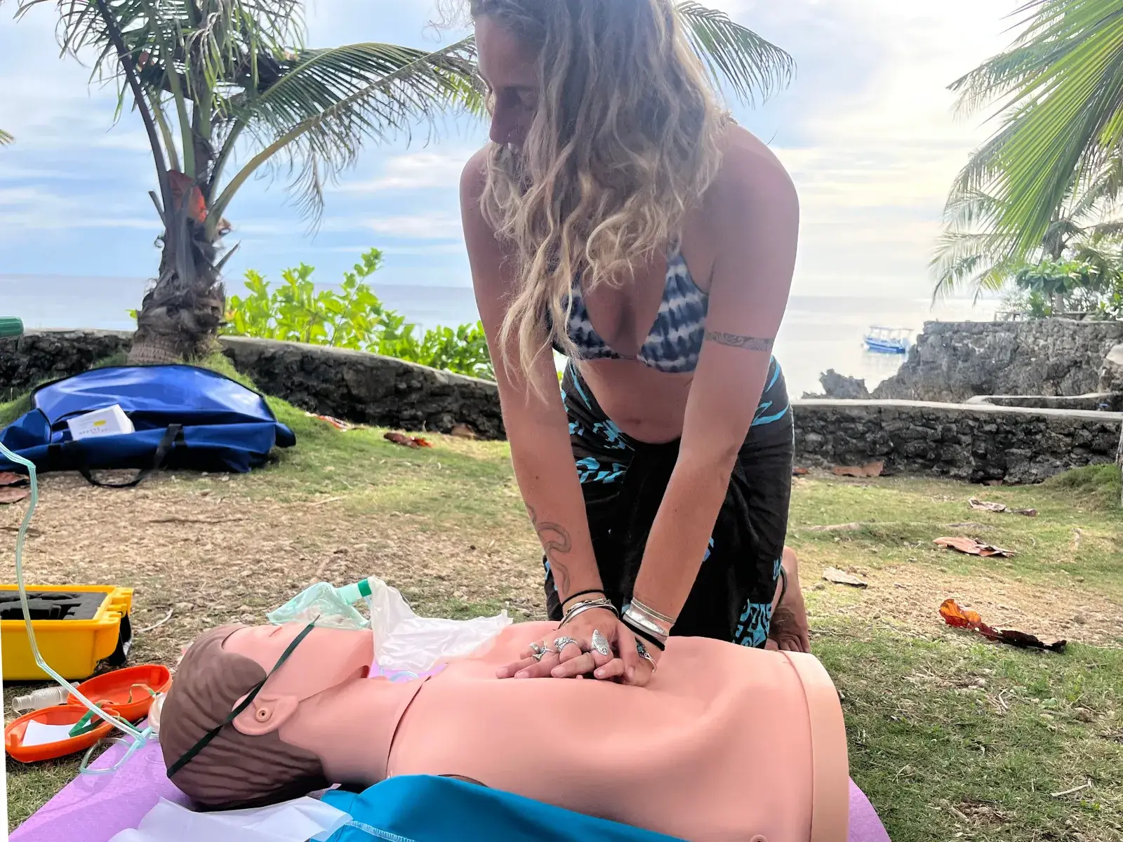 Student practicing CPR on a training mannequin during an Emergency First Response course in Siquijor
